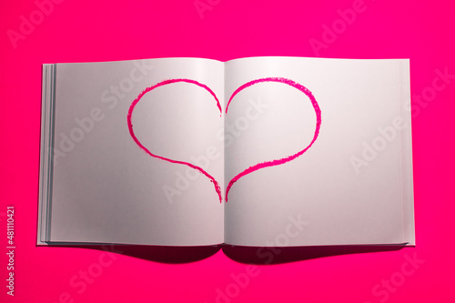  Notebook with white blank pages for notes on a yellow background. High quality photo