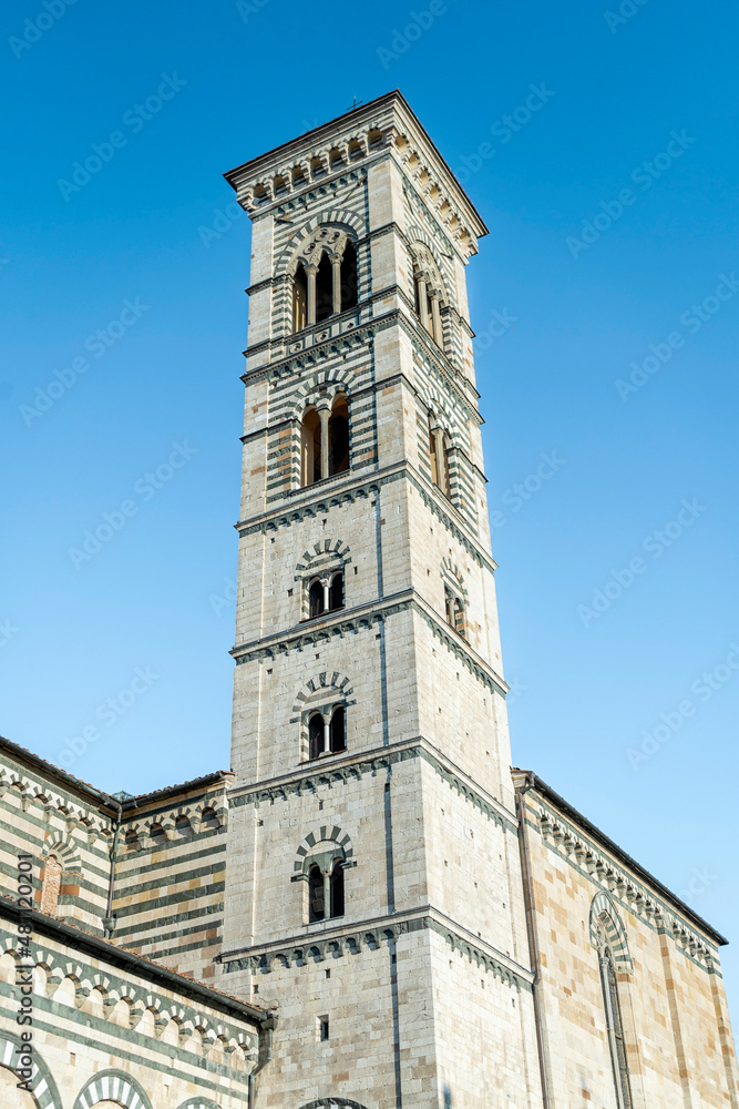 The marbled bell tower of Prato cathedral, or Cathedral of Saint Stephen, in Romanesque style, Duomo square, Prato city, Tuscan region, Italy