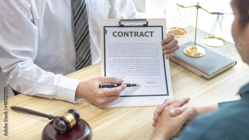 Attorney or legal counsel has introduced the legal requirements in the paperwork and filed a lawsuit against embezzlement with the offender, Law and Legal services concept.