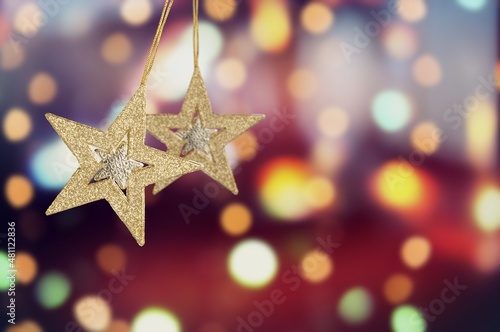 Christmas warm gold garland lights over dark background for glitter overlay © BillionPhotos.com