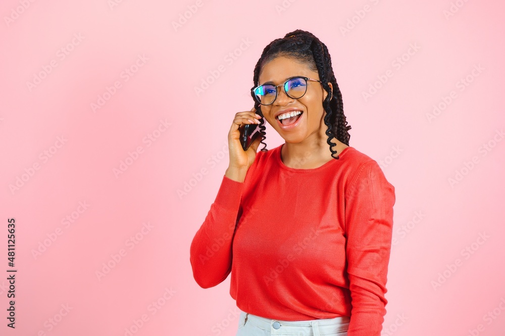 Portrait of pretty cheerful girl talking on phone discussing news cellular isolated over pink pastel color background Portrait of pretty cheerful girl talking on phone discussing news cellular isolated over pink pastel color background