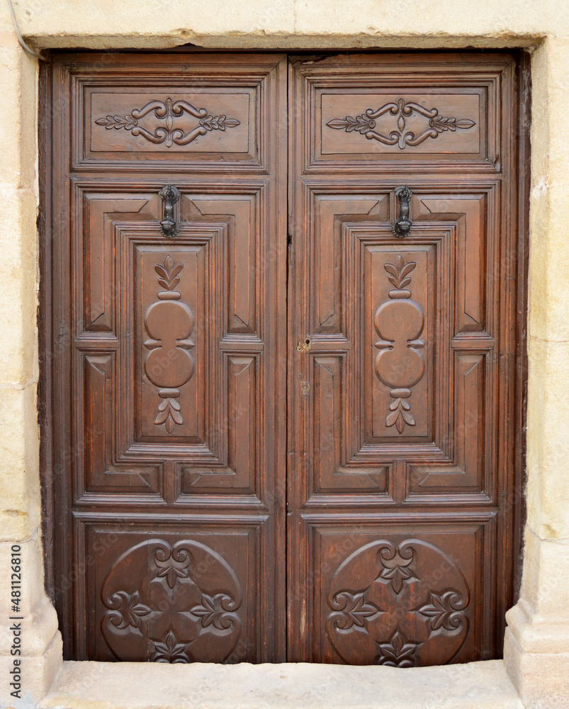 Old wooden door of a traditional house in a town in the province of Jaén in Andalusia, Spain 