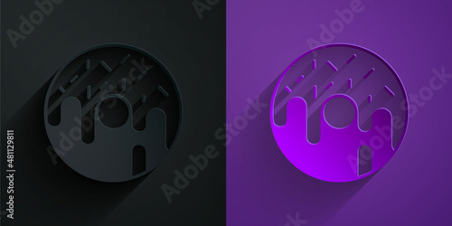 Paper cut Donut with sweet glaze icon isolated on black on purple background. Paper art style. Vector