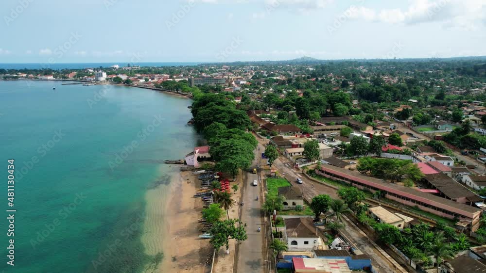 Aerial drone view following traffic in Sao Tome city, sunny day in West Africa Aerial drone view following traffic in Sao Tome city, sunny day in West Africa
