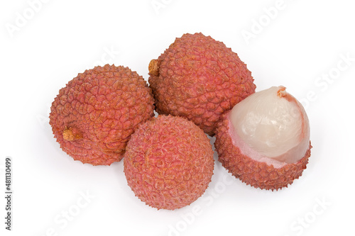 Whole and opened ripe lychee fruits close-up