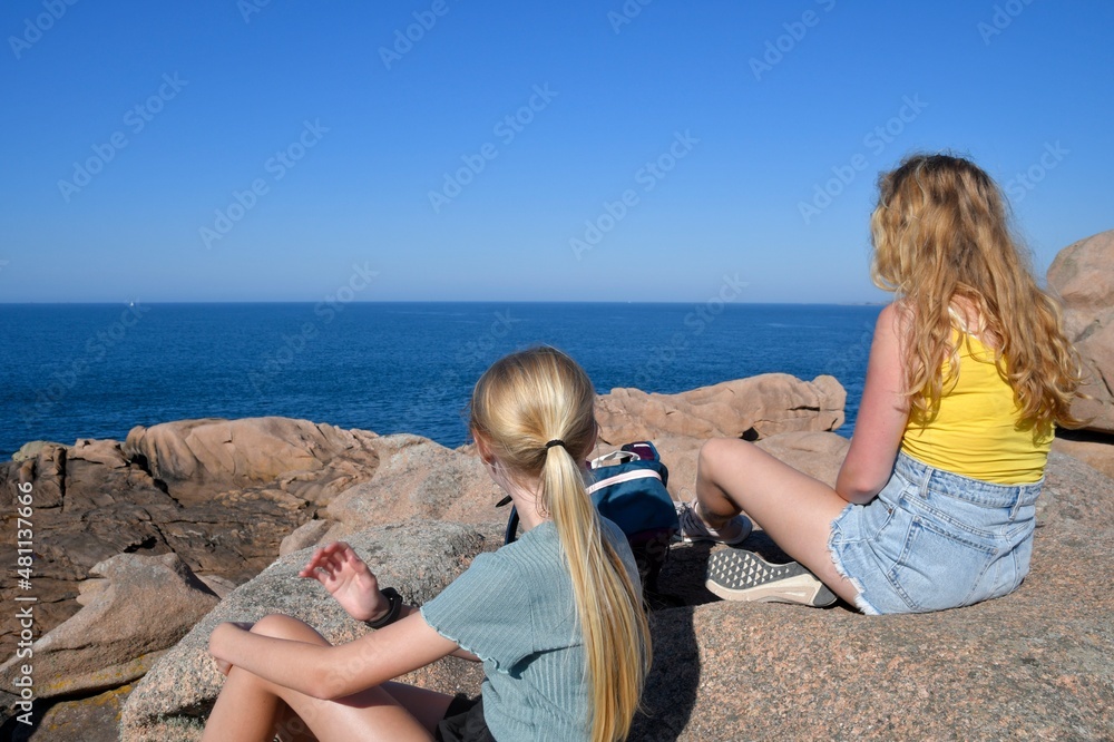 Teenages  watching the ocean in Brittany-France