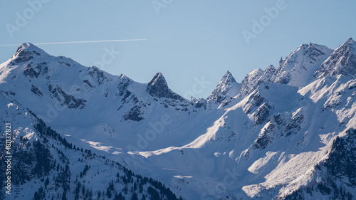 view of the snow capped alps  the hohe tauern in the national park in austria  at a clear sunny winter day