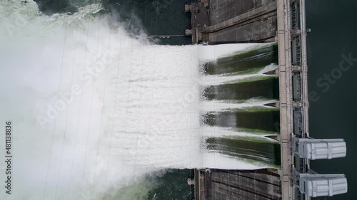 Aerial top down view of water discharge at hydroelectric power plant of Krasnoyarsk city, Siberia, Russia photo