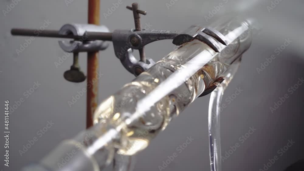 Close up of spiral reflux condenser, handling equipment in chemistry lab, 4K
Close up of spiral reflux condenser, handling equipment in chemistry lab, 4K