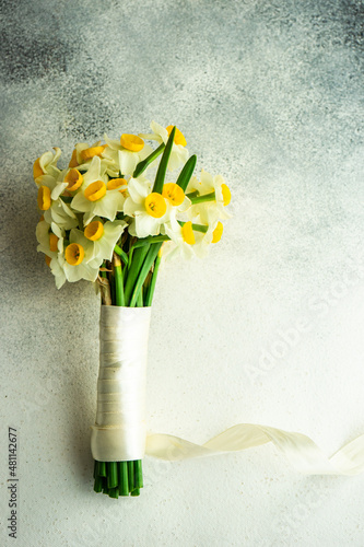 Bouquet of narcissus flowers tied with a ribbon
