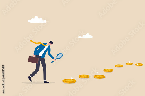 Searching for investment opportunity, financial success or salary raise, inspect way to make profit and earning concept, curios businessman with magnifier inspect and follow money coins trail.
