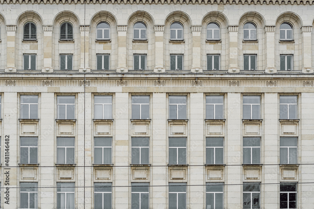 Facade of a building with monumental architecture, typical of the Stalin period (Stalinist style or Socialist Classicism), Sofia, Bulgaria.