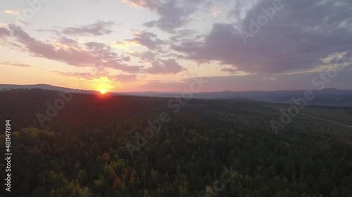 ProRes. Lake Baikal. Olkhon Island. Sunset over the forest. Khuzhir village. Summer shooting from a drone.