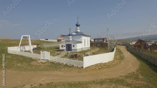 ProRes. Lake Baikal. Olkhon Island. Church in the center of the island. Khuzhir village. Summer shooting from a drone.