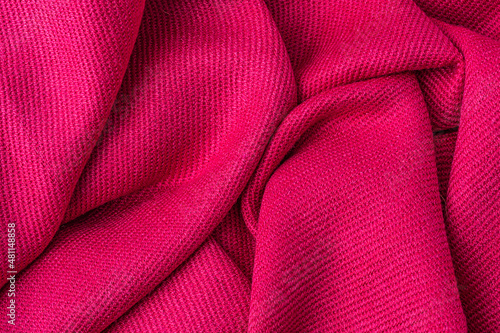 Photos wrinkled pink fabric texture background close up