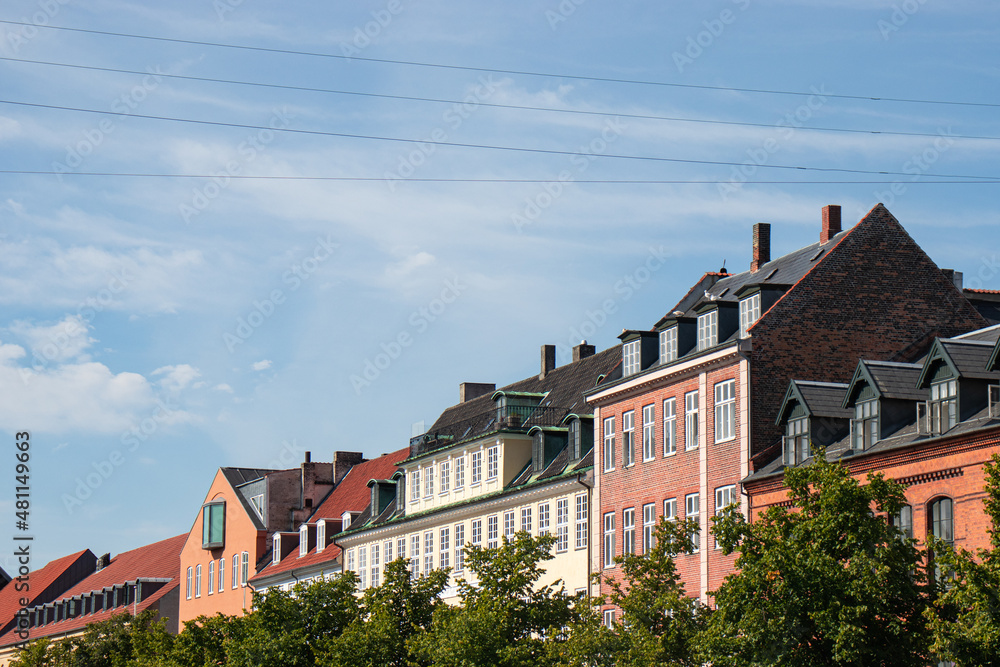 Copenhagen, Denmark-Christianshavn canal, colorful facades of old houses. King Christian's Harbour is a neighbourhood in Copenhagen. Real estate investment. Rent an apartment. Expensive housing. 