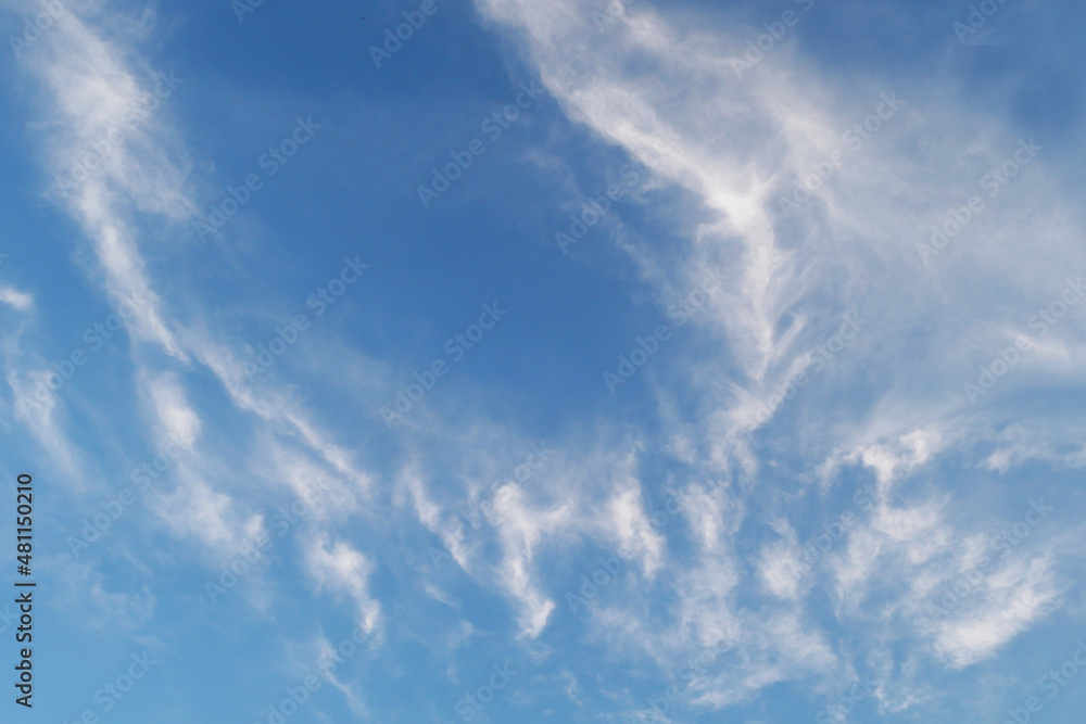 Cirrus white clouds in the blue sky.