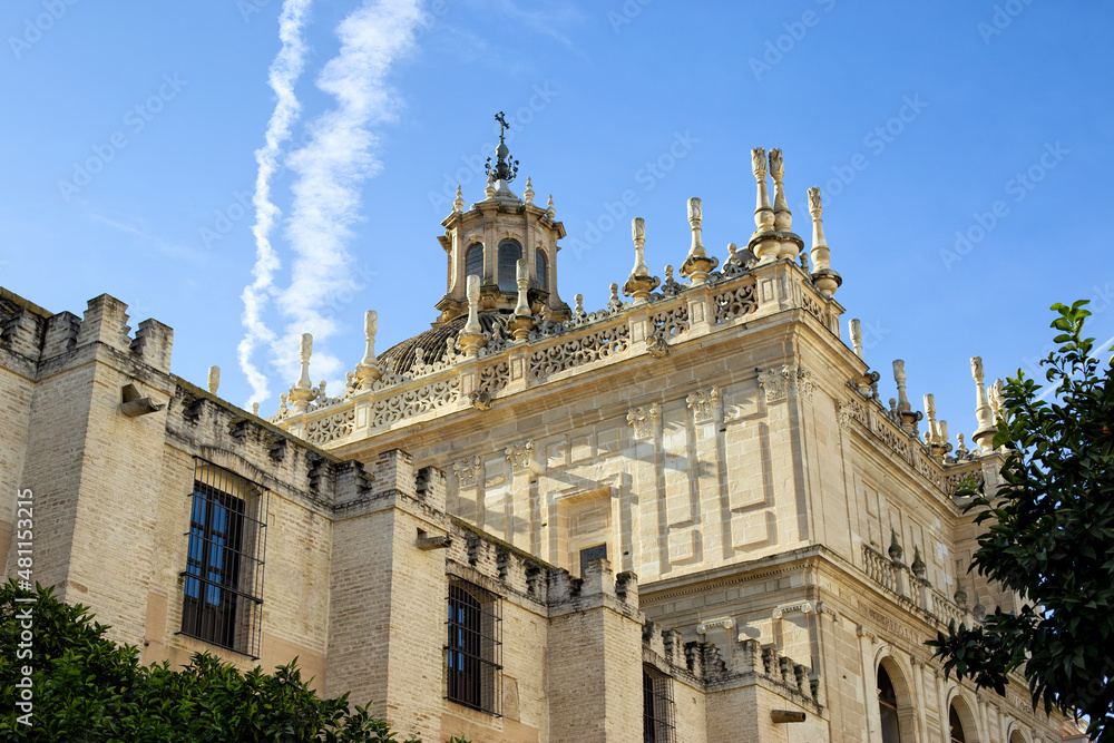 Gothic building of the Cathedral of Saint Mary of the See (Seville Cathedral) on sunny day. Seville (Sevilla), Andalusia, Southern Spain.