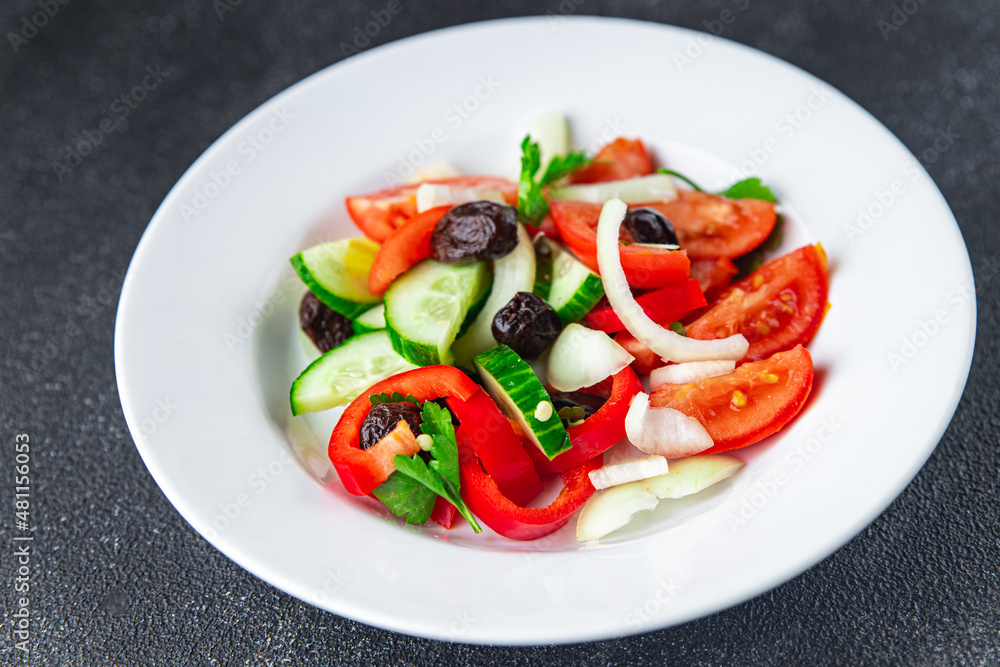 fresh vegetable salad tomato, cucumber, pepper, onion, black olives pitted healthy meal food snack on the table copy space food background rustic top view keto or paleo diet