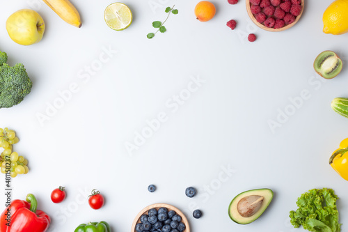 Fresh fruits and vegetables on grey background. Healthy eating concept. Flat lay, copy space.