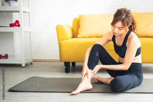 Free Download Asian attractive young woman, is currently having a ankle injury During his exercise in home, due to osteoarthritis, to sports and health care concept. - GFXLoad