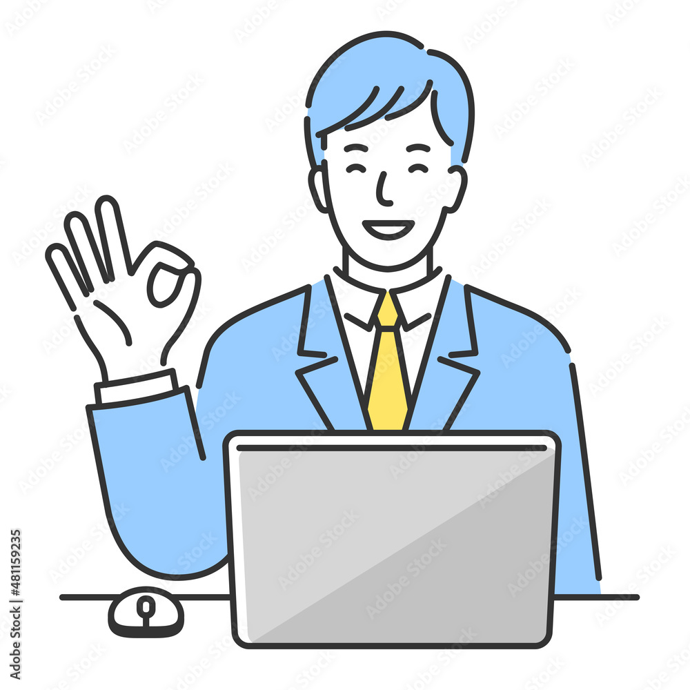 ノートパソコンの前に座ってOKサインを出す笑顔の若いビジネスマン。