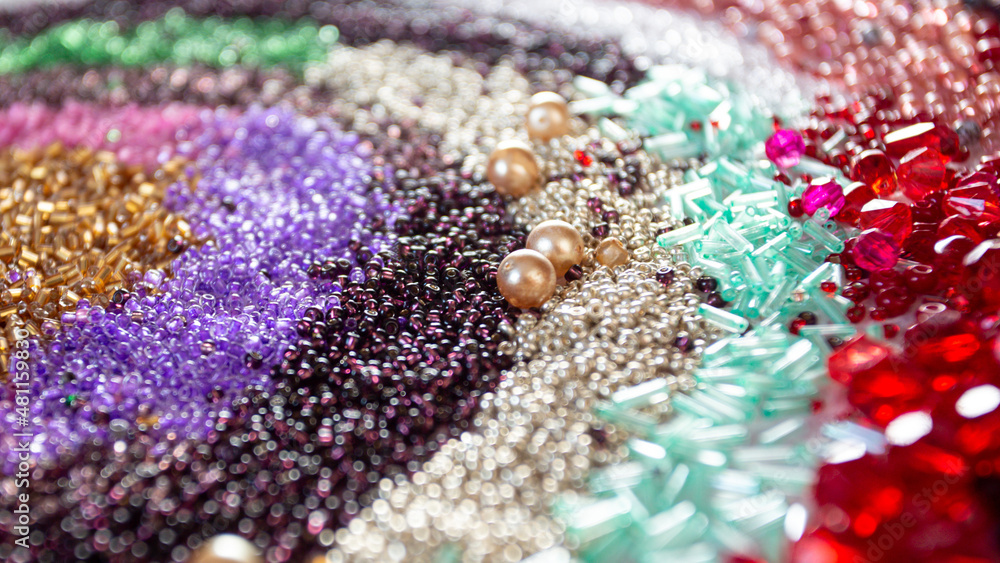 Beads banner. Multicolored beads background .Handicraft and hobby banner. Weaving and embroidery with beads concept Beads banner. Multicolored beads background .Handicraft and hobby banner. Weaving and embroidery with beads concept