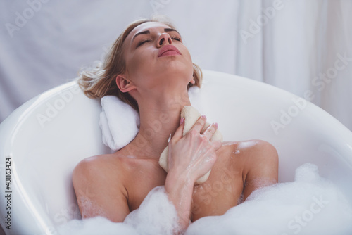 Fotografie Woman taking a bath