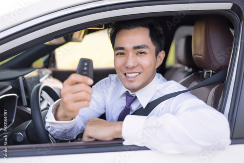 Business Man smiling and  showing car keys © Tom Wang