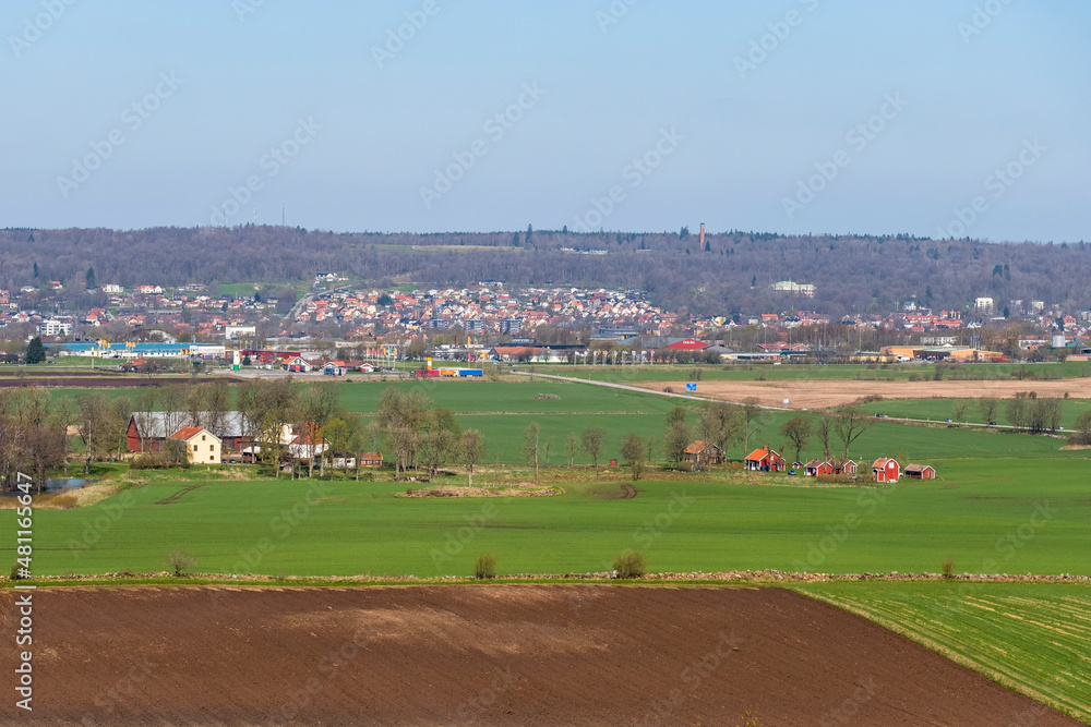 Landscape view of the fields towards a Swedish small town in the spring
