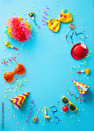 Fototapeta Naklejka Na Ścianę i Meble -  Colorful party items for carnival or birthday party on blue background