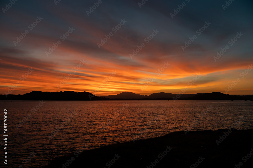 sunset over the sea and mountains