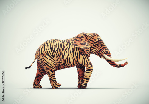 Принти на полотні Elephant with tiger skin on studio background.