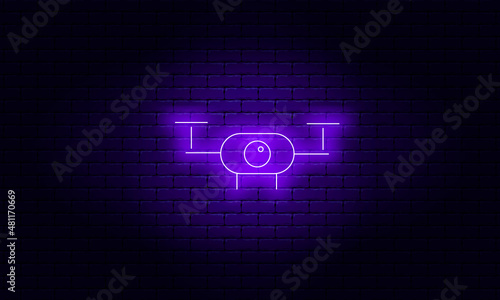 Neon quadcopter on a brick wall background, vector illustration