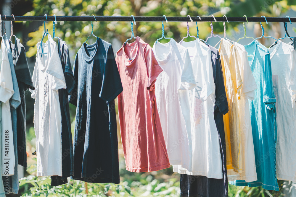 Washing day with T-shirts hanging on clothesline.