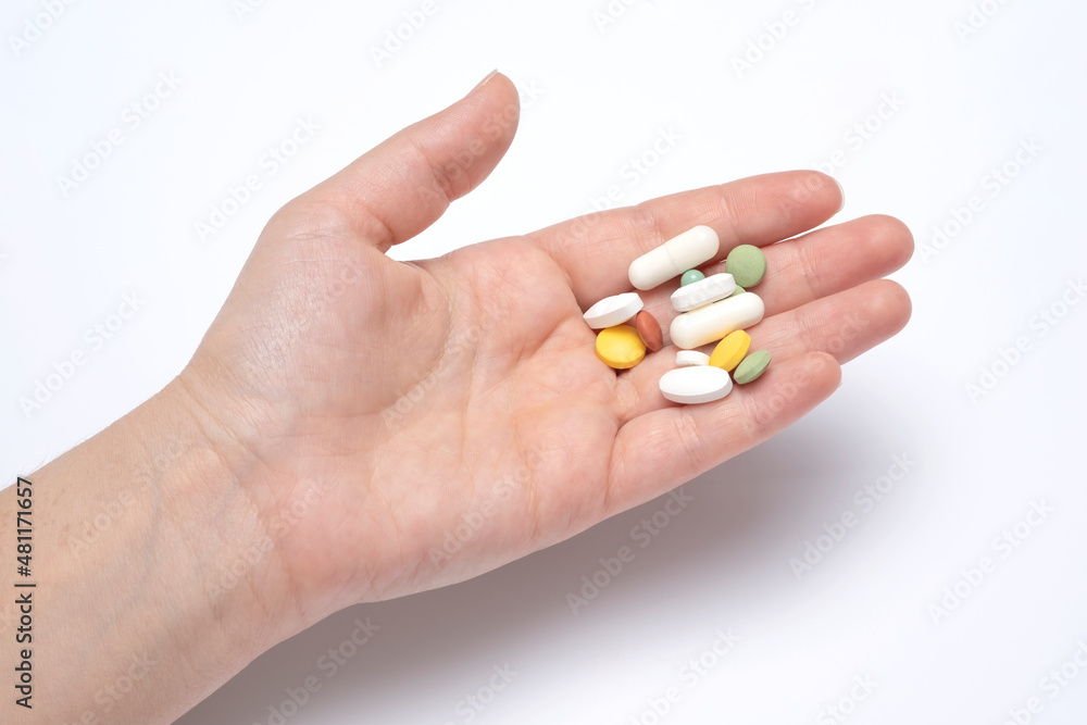hands holding a pill hands holding a pill