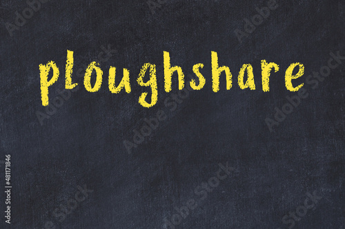 Vászonkép College chalk desk with the word ploughshare written on in