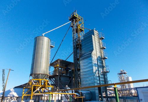Grain plant with equipment on a blue sky background