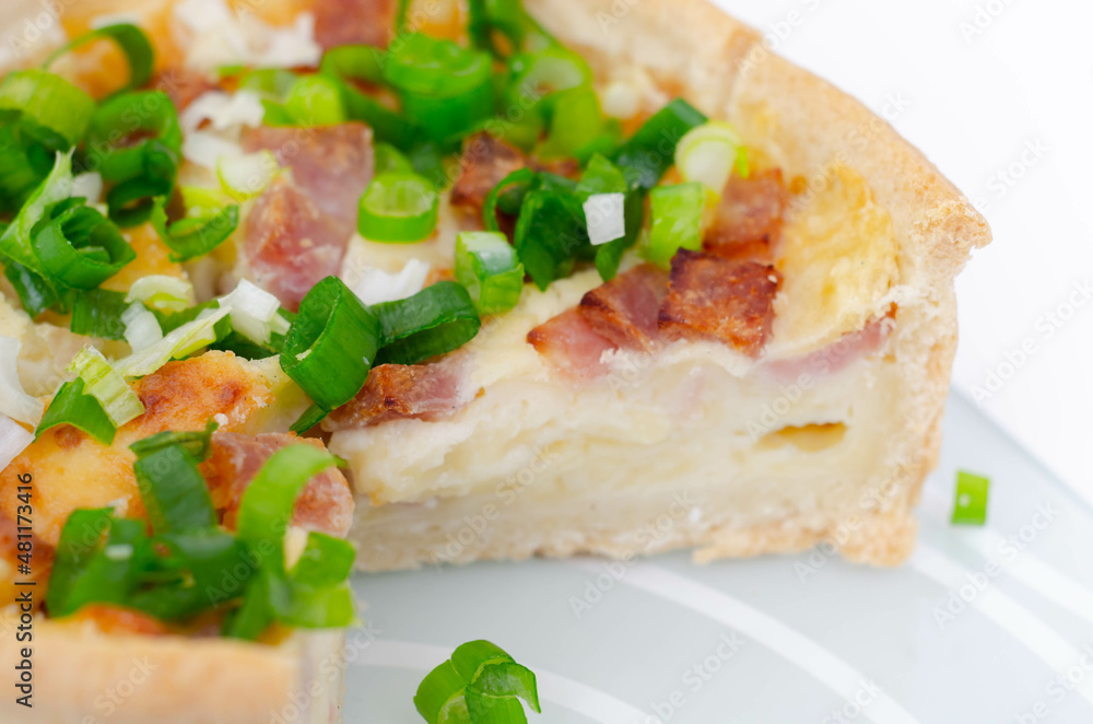 Quiche Lorraine, smoked bacon with medium and mature cheddar cheese and egg quiche filling in a shortcrust pastry Quiche Lorraine, smoked bacon with medium and mature cheddar cheese and egg quiche filling in a shortcrust pastry