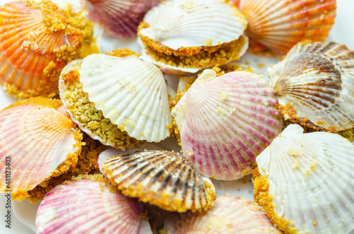 Mini coquilles St. Jacques, Natural scallop shells filled with Patagonian scallops and Thermidor sauce topped with a ciabatta breadcrumb topping