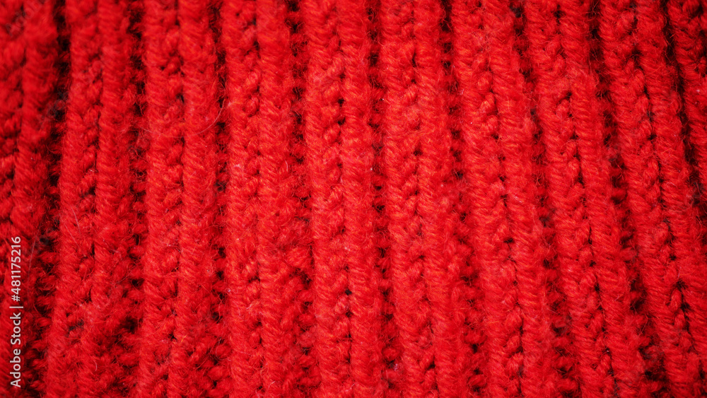 Red wool knitted background. Handmade textile pattern Red wool knitted background. Handmade textile pattern