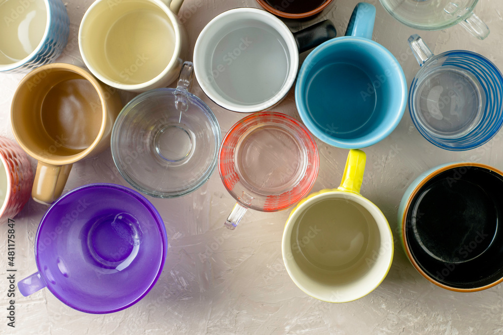 empty mugs of different shapes and sizes on the table empty mugs of different shapes and sizes on the table