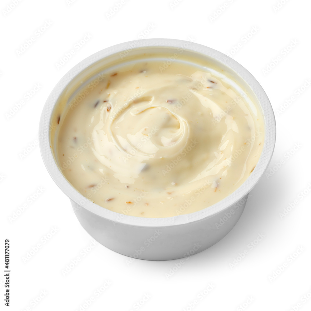 Plastic dish with low fat Goats cream cheese and cumin close up isolated on white background Plastic dish with low fat Goats cream cheese and cumin close up isolated on white background