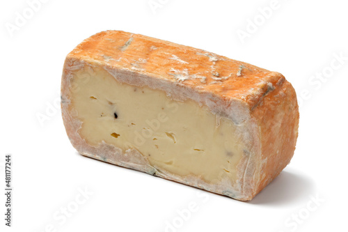 Piece of Italian taleggio with tuber isolated on white background close up photo