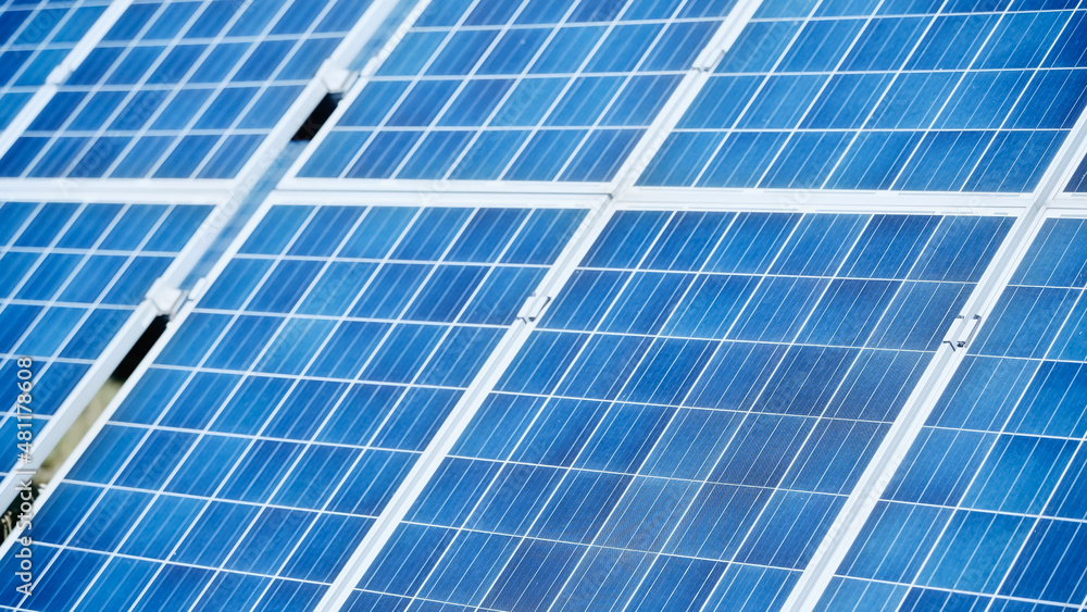 blue construction of solar battery panels against sky blue construction of solar battery panels against sky