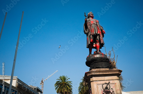 Valparaiso, Chile - February, 2020: Monument to Christopher Columbus or Monumento a Cristobal Colon in Spanish damaged by red paint. Vandalism towards monument to Christopher Columbus in Latin America