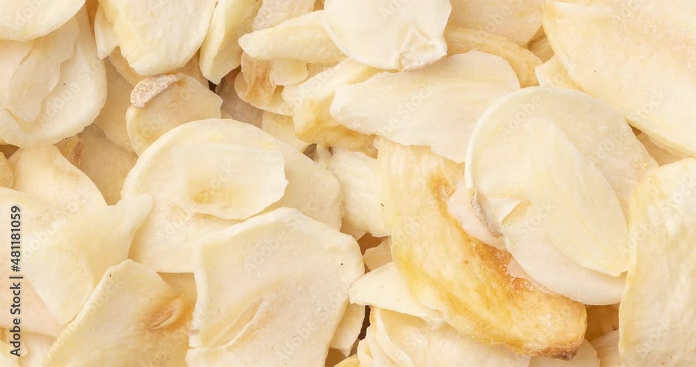 Top view, closeup of dried garlic slices. Food backdrop Top view, closeup of dried garlic slices. Food backdrop