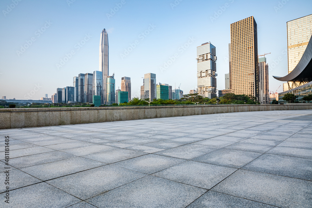 Empty square floor and city skyline with modern commercial office buildings in Shenzhen, China. Empty square floor and city skyline with modern commercial office buildings in Shenzhen, China.