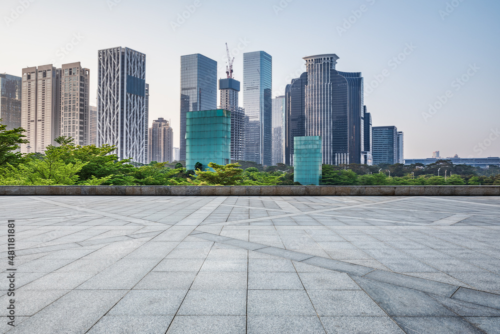 Empty square floor and city skyline with modern commercial office buildings in Shenzhen, China.