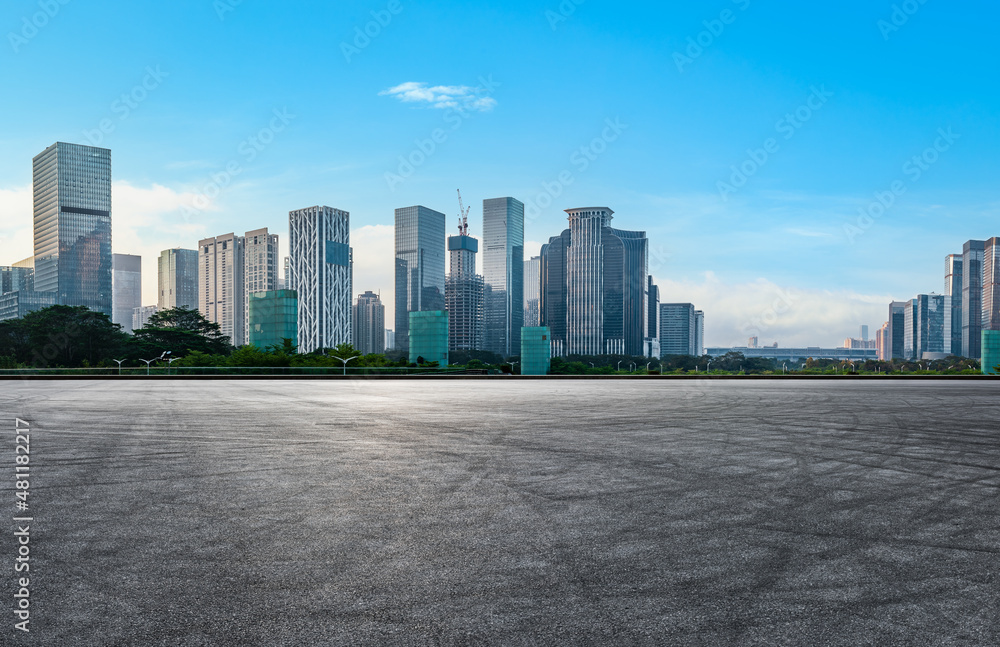 Asphalt road and city skyline with modern commercial buildings in Shenzhen, China. Asphalt road and city skyline with modern commercial buildings in Shenzhen, China.